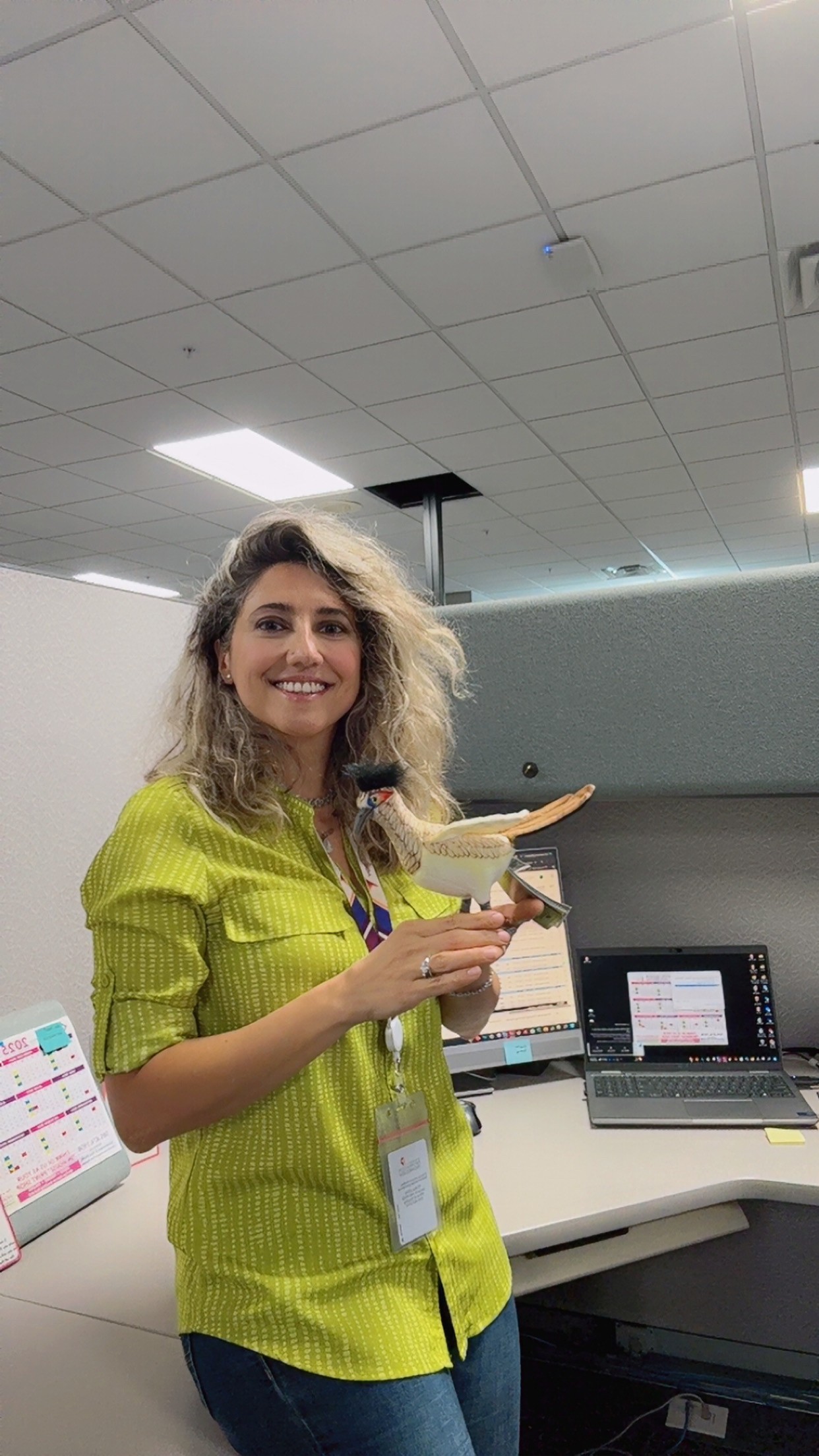 Azadeh Zamanian holding her Roadrunner award.