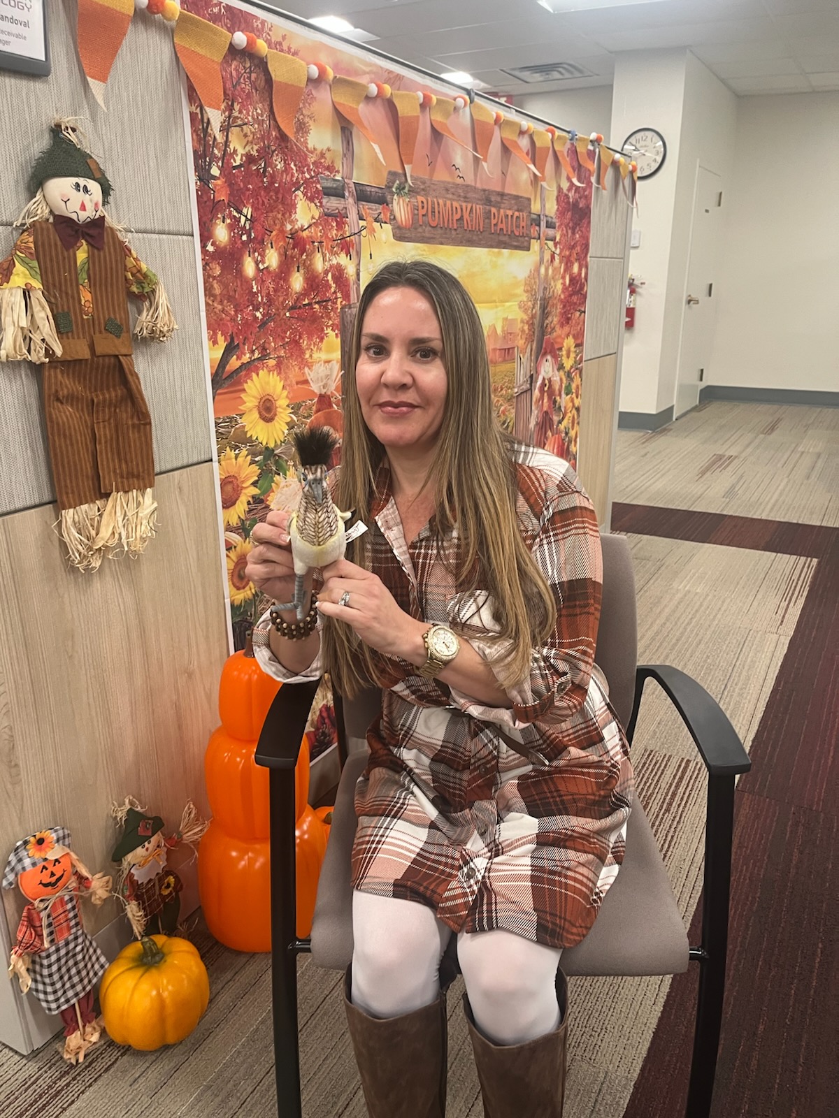 Melody Sandoval posing with her Roadrunner award.