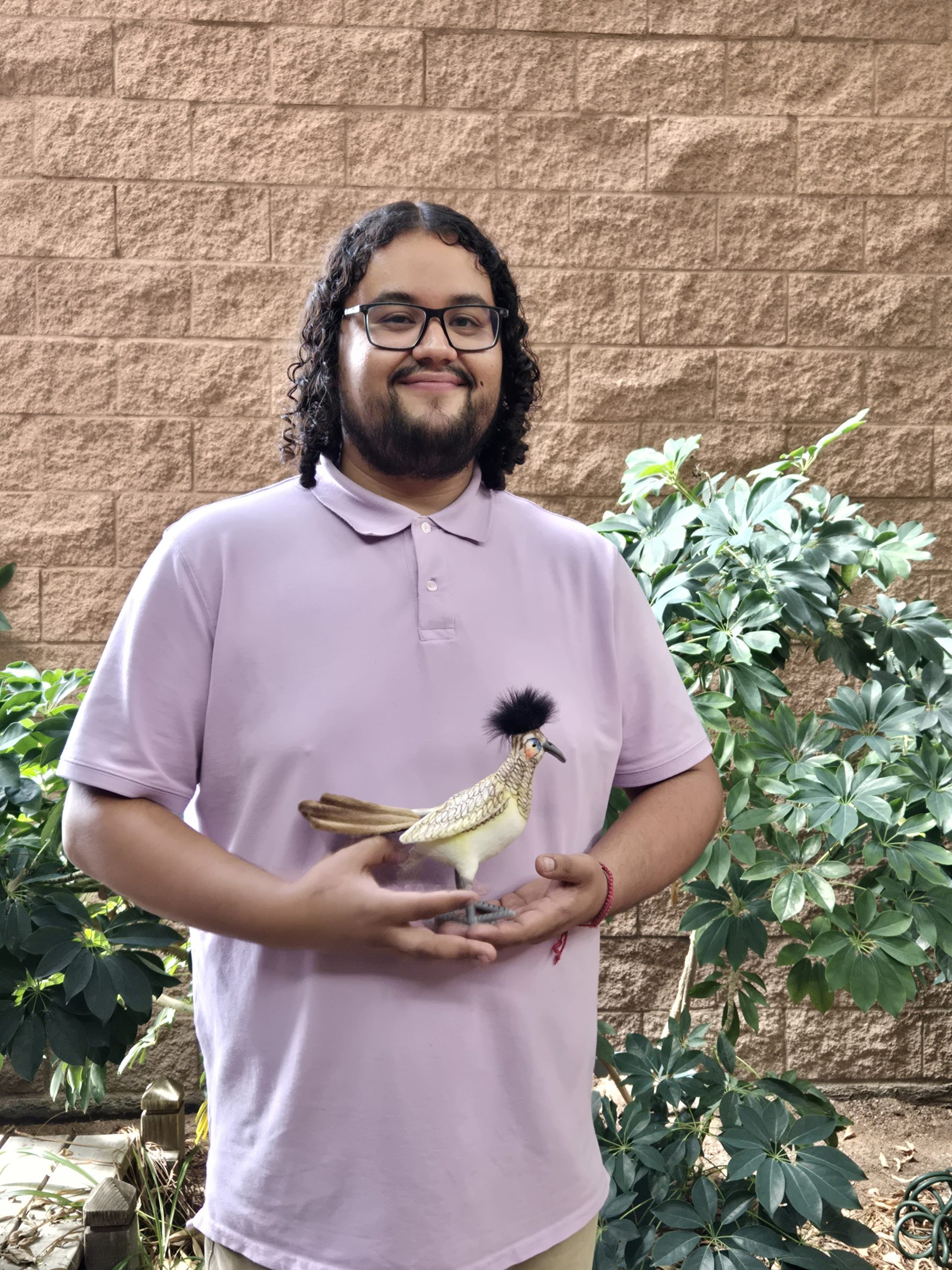 Noe Trevizo holding his Roadrunner award.